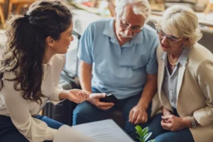 Family office advisor reviewing household and document needs with a client couple